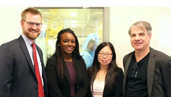 Dr. Gary Kobinger, former chief of special pathogens (right), and Dr. Xiangguo Qiu, research scientist (second from right) met with Dr. Kent Brantly and Dr. Linda Mobula, assistant professor at Johns Hopkins School of Medicine and the physician who administered ZMapp to Brantly in Liberia when he was infected with Ebola during the 2014-16 outbreak. (Submitted by Health Canada)